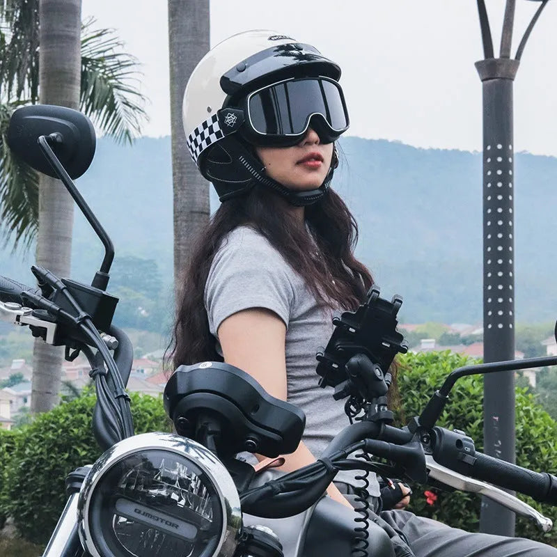 Retro style motorcycle helmet shown in cement grey colour on a plain background.