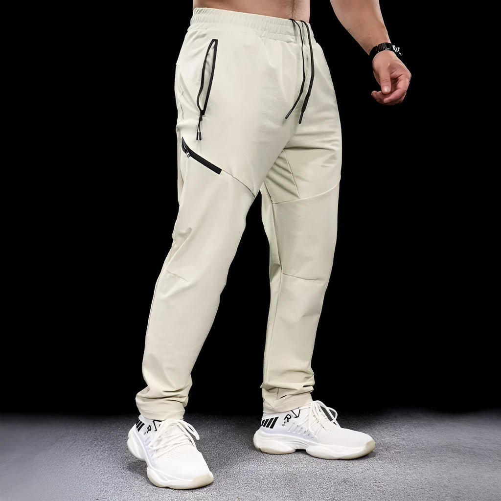 Men's waterproof quick-drying nylon workout trousers with elasticated mid-waist in multiple colour options