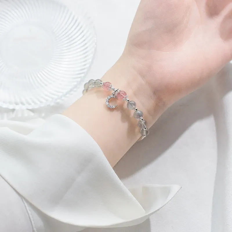Adjustable moonstone bracelet with crescent moon charm and crystal on extension chain