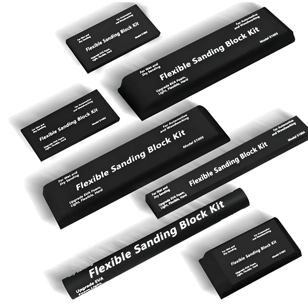 Set of seven black metal frosted blocks arranged together on a surface.