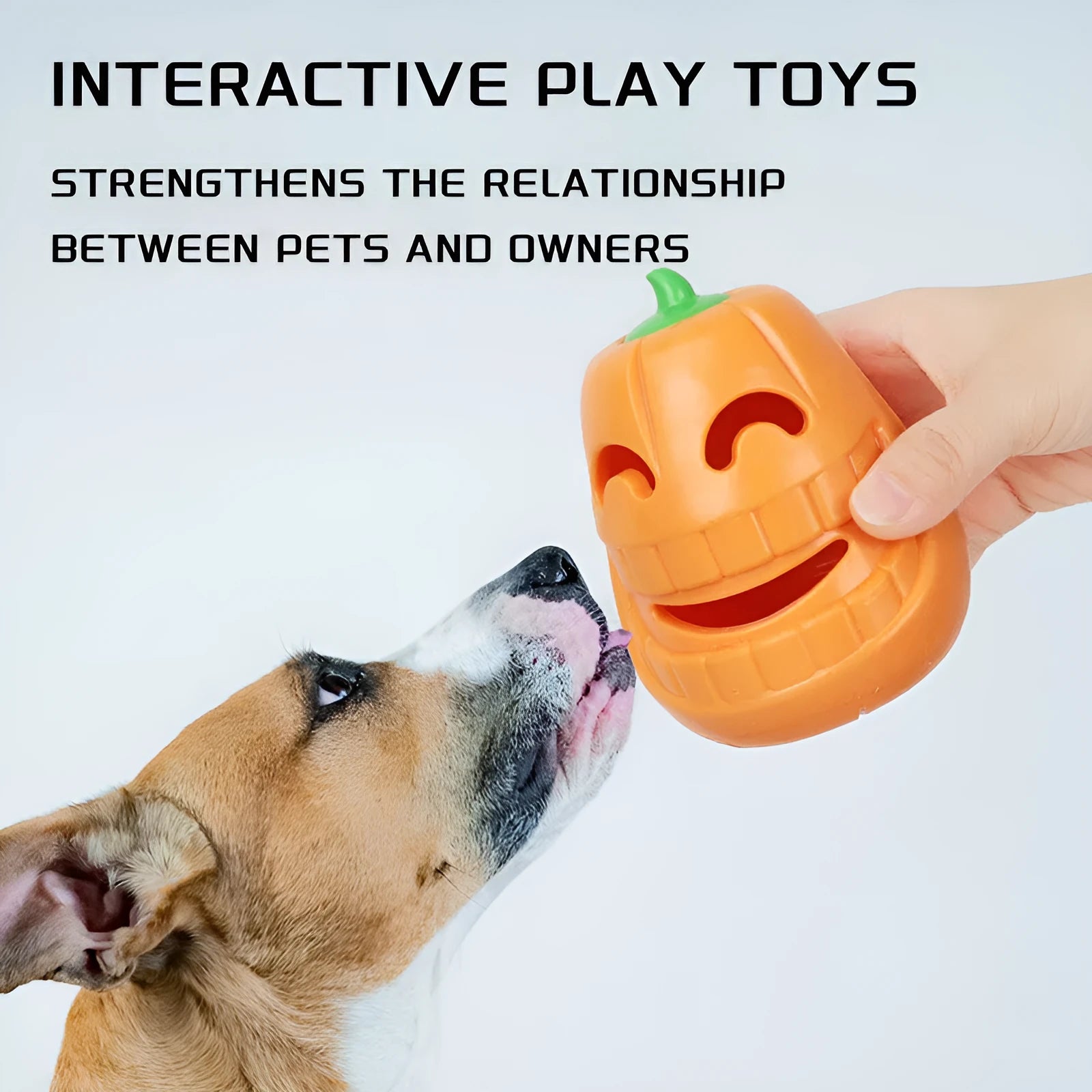 Orange Halloween pumpkin shaped durable rubber dog toy with a treat-dispensing funnel opening.