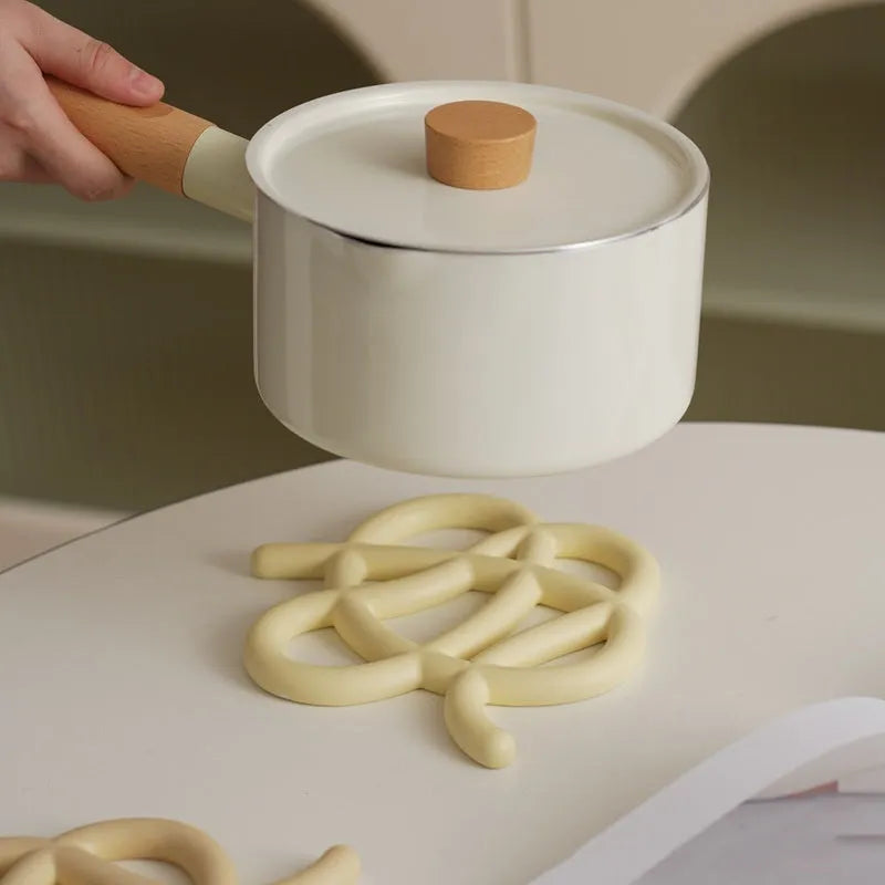 Ceramic heat-resistant pot mat in irregular shape with non-slip silicone pads