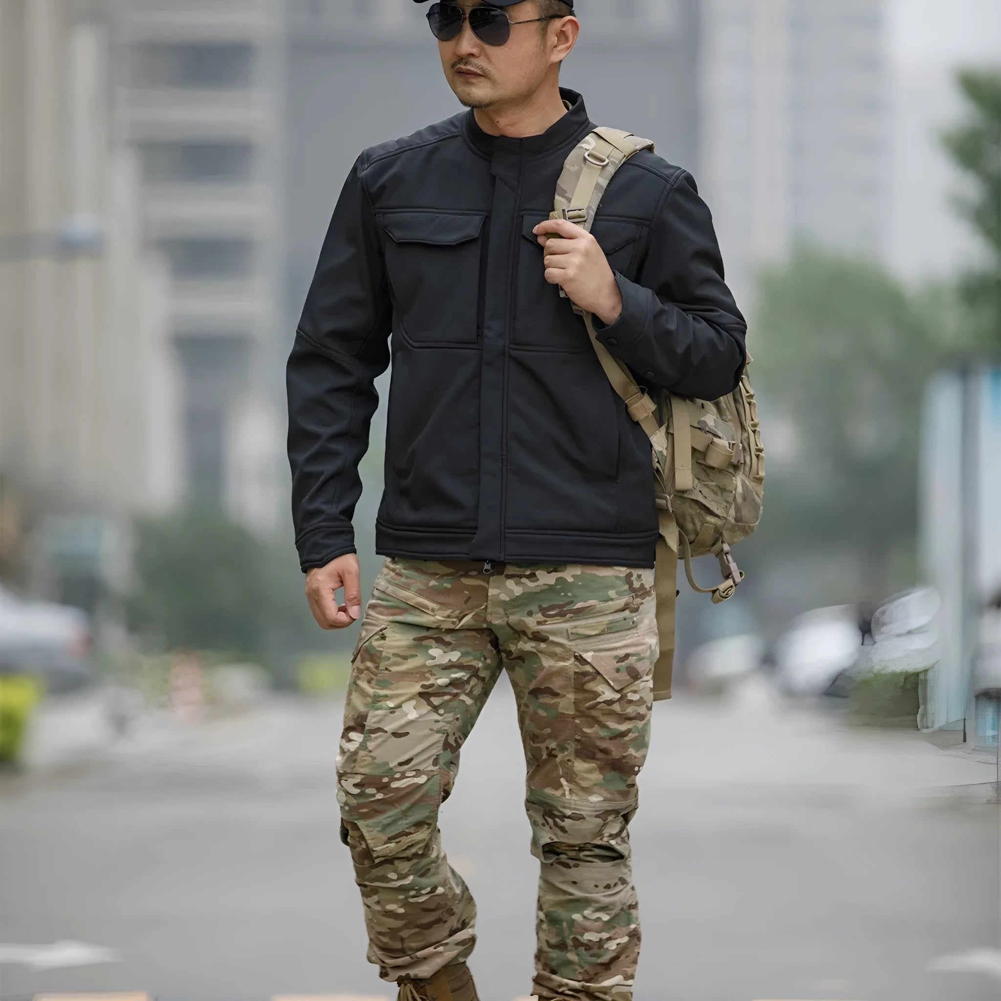 Bone Frog Peak Breaker soft shell tactical jacket in black, shown in outdoor setting.