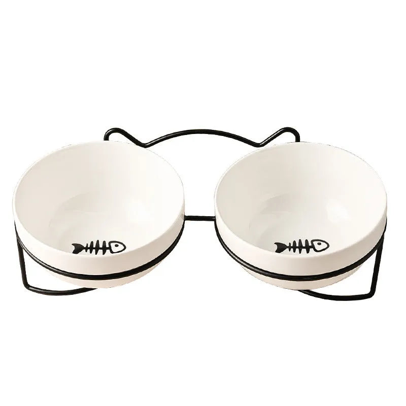White ceramic cat bowl with decorative pattern and black iron frame support