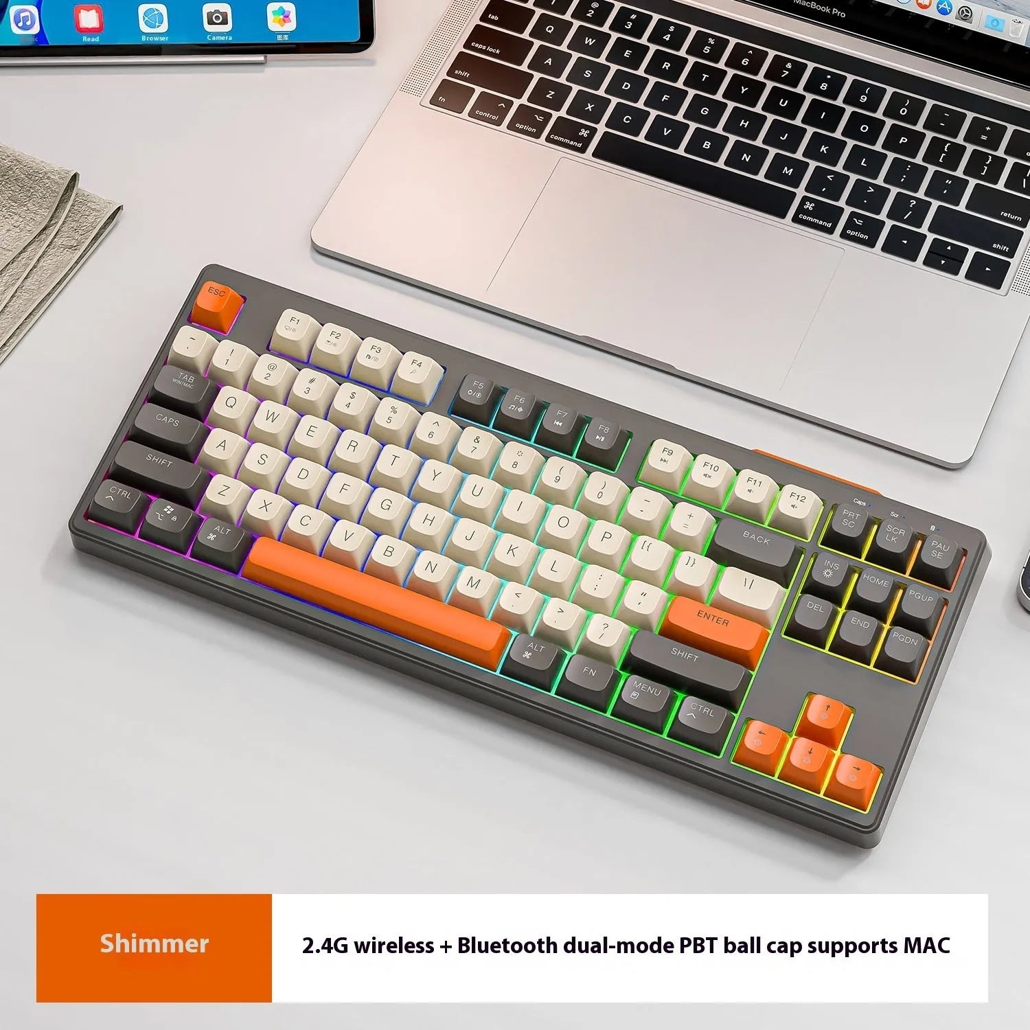 Free Wolf M87 wireless dual-mode keyboard in blueberry colour on a desk with USB receiver and cable.