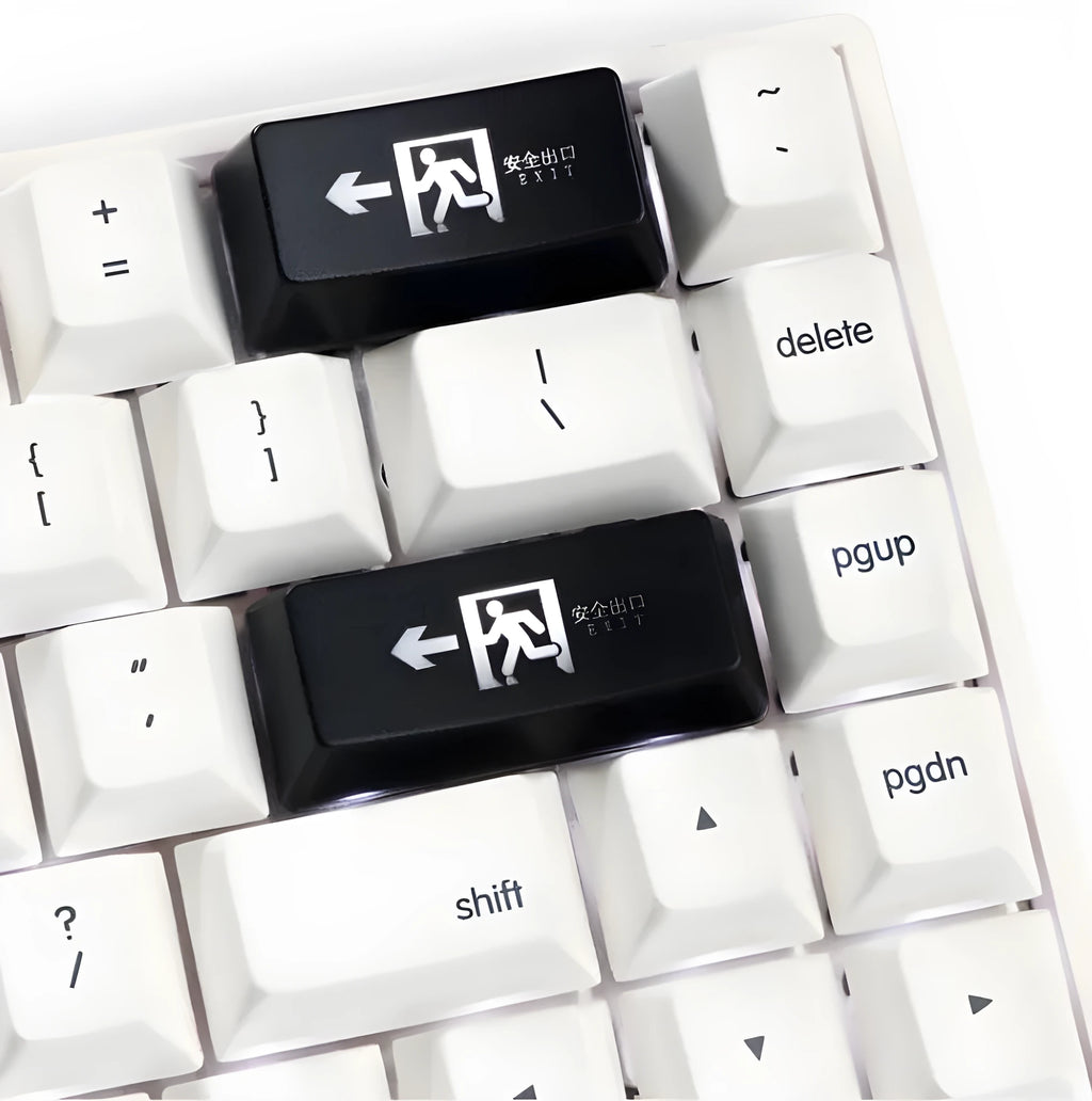 Transparent mechanical keyboard key cap with raised safety evacuation exit text