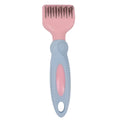 Pink dual-ended pet grooming brush with stainless steel knot knife and massage pins on a white background
