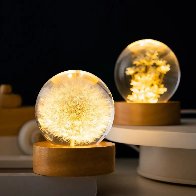 Luminous 3D dandelion crystal ball on a beech wood stand, glowing as a USB-powered desktop night light.