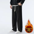 Men's apricot coloured loose-fit polar fleece trousers with a drawstring waistband, shown laid flat.