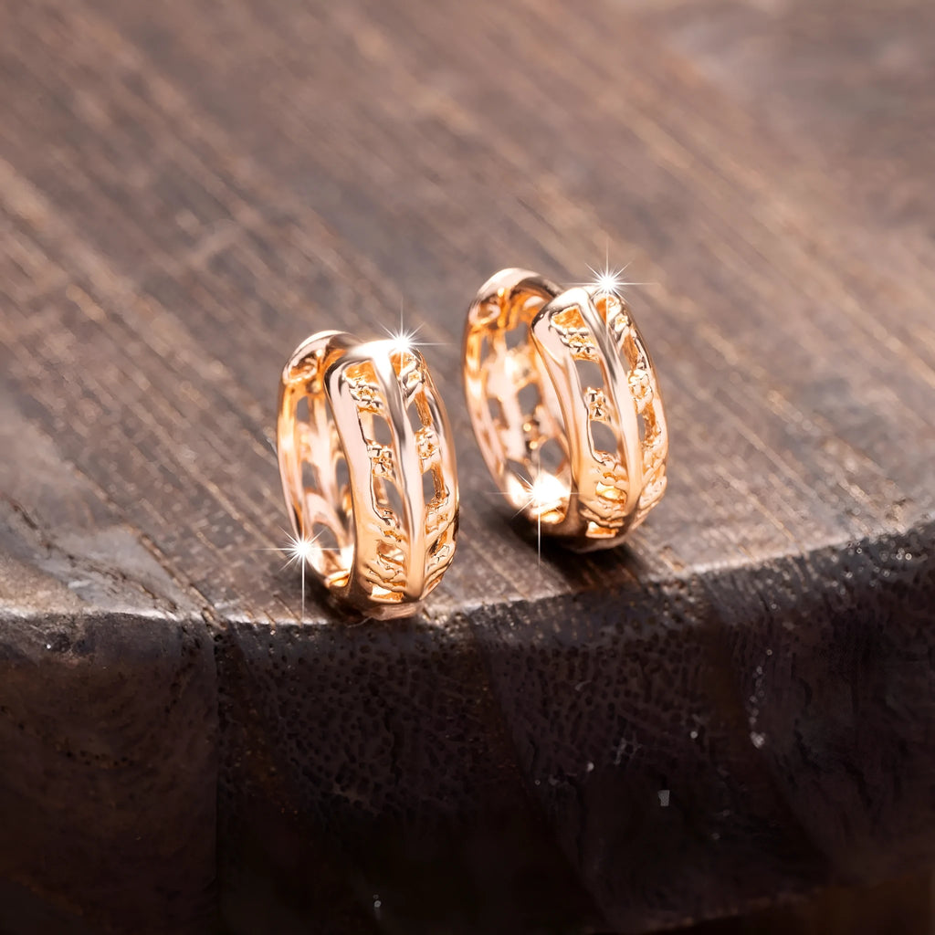 Rose gold plated hollowed-out copper earrings in a leaf shape design