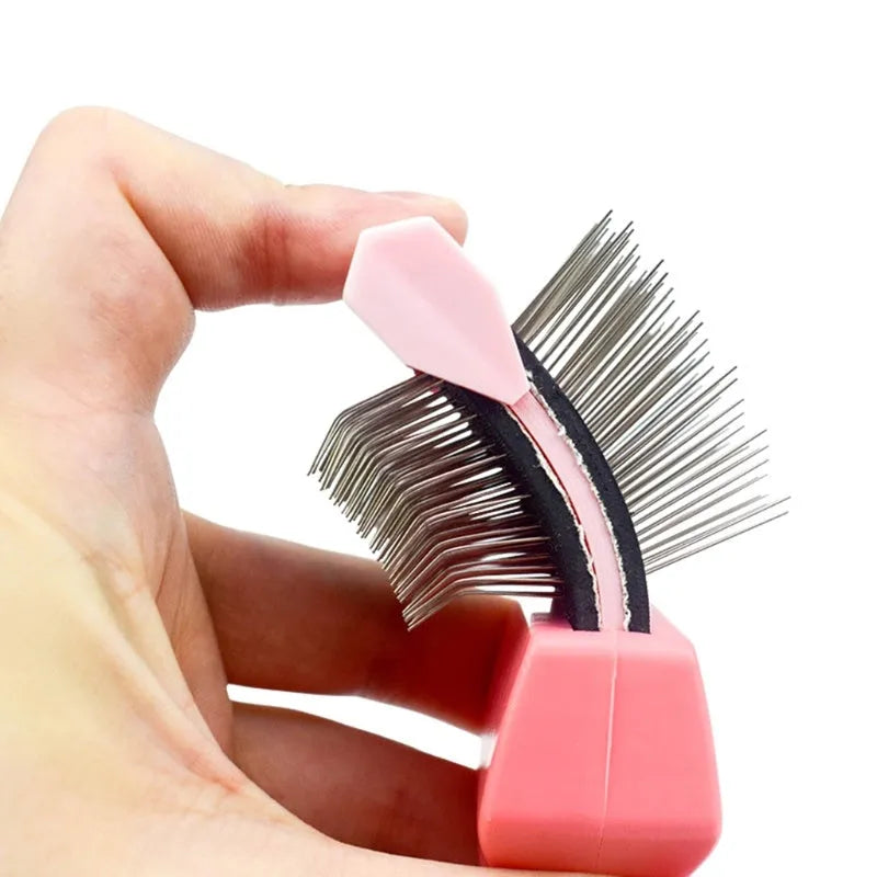 Blue double-sided pet brush with ergonomic handle shown next to pink version, displaying soft and firm stainless steel pin sides.