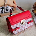 Retro patterned women's crossbody bag in a horizontal rectangle shape, shown in apricot colour.
