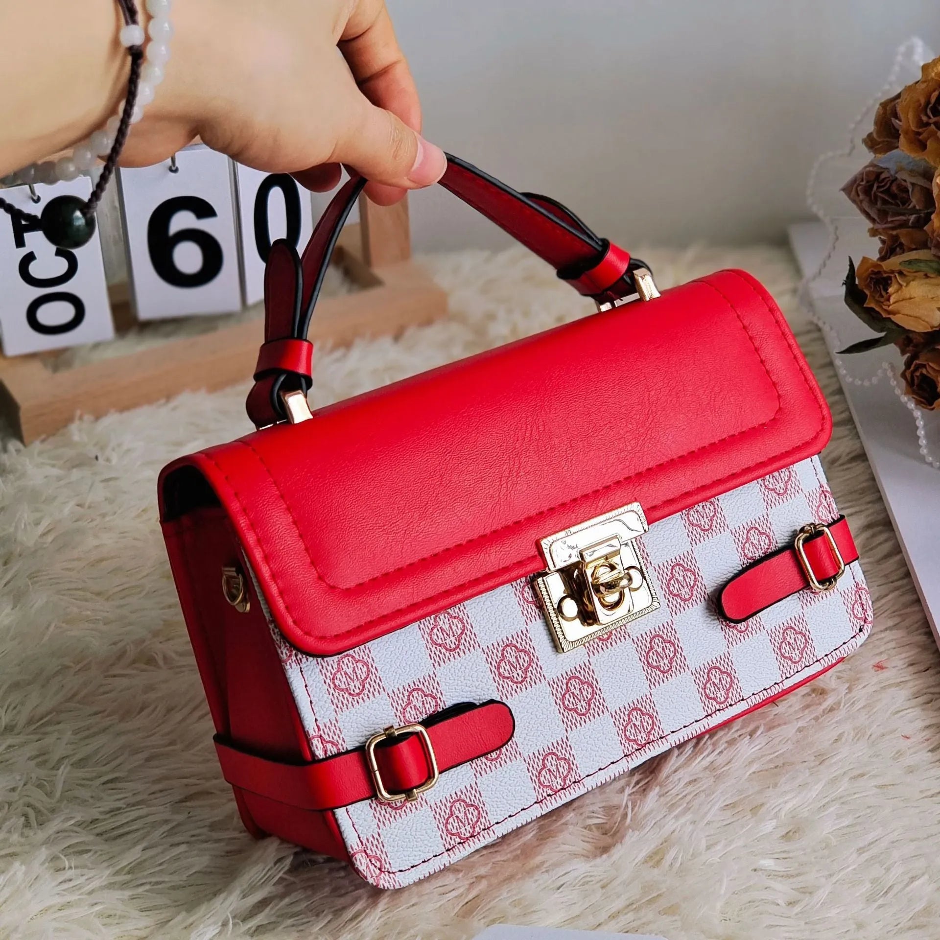 Retro patterned women's crossbody bag in a horizontal rectangle shape, shown in apricot colour.