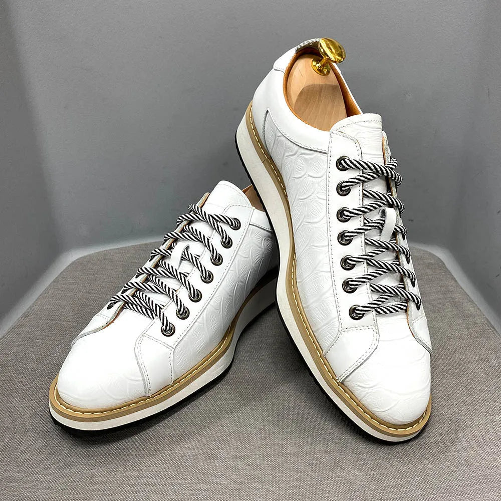 Men's low-top leather sneakers with an embossed pattern on the upper, shown in a choice of colours.