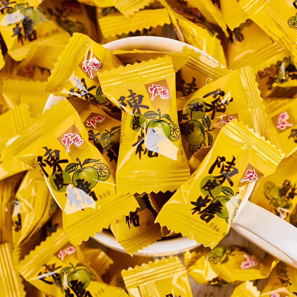 Bag containing three packets of hard candy: guava, plum sugar, and tangerine peel flavours.
