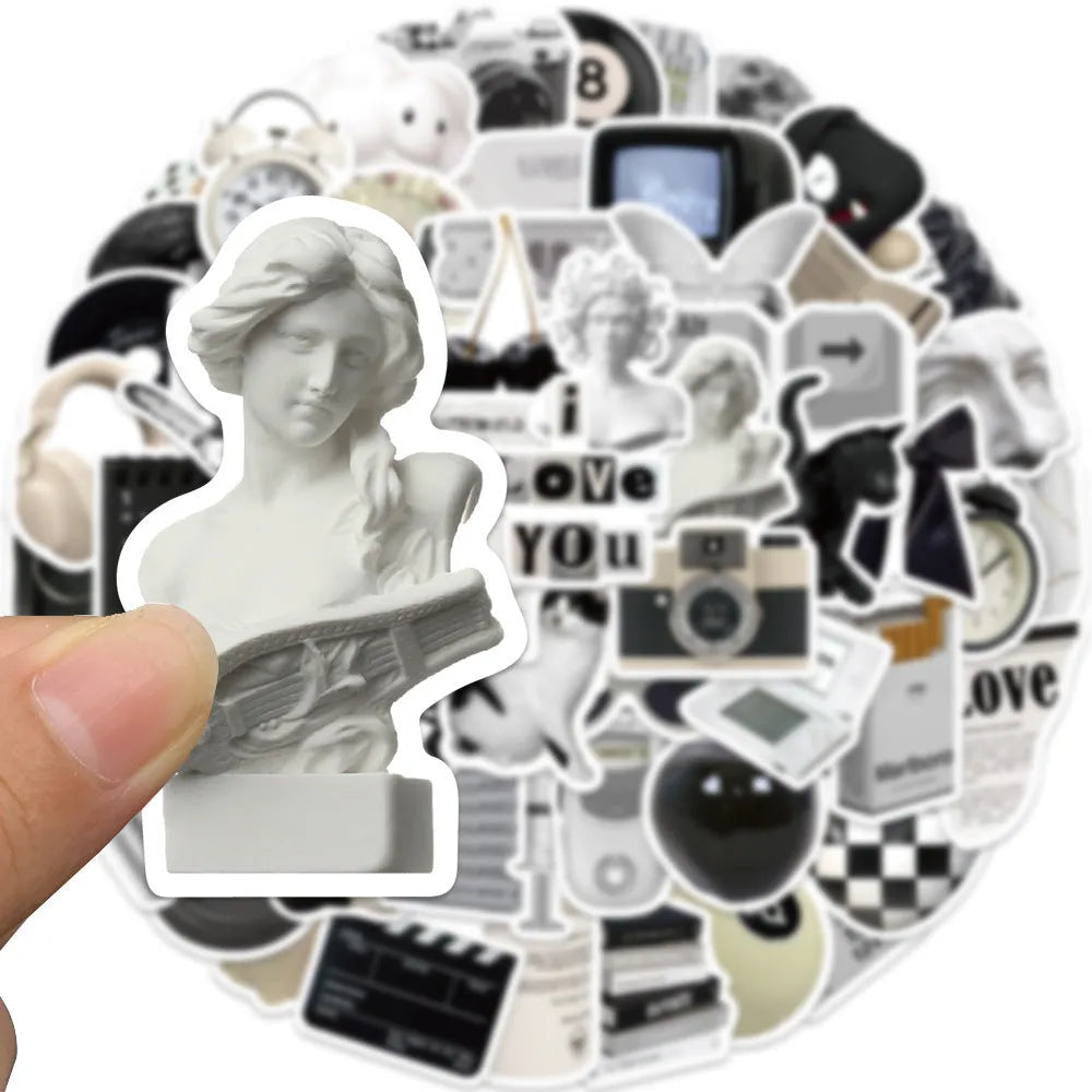 Pack of 61 black and white waterproof PVC stickers for laptops and drinkware.