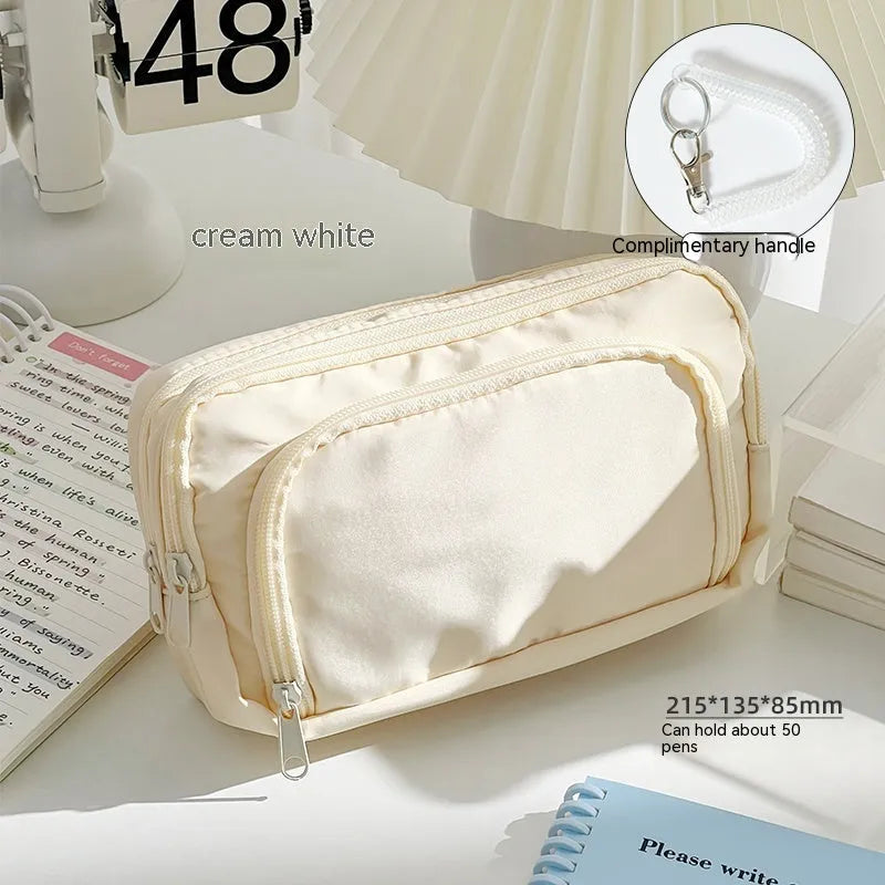 Double layer pencil case in blue, pink, green or cream with gift handle and 215x135x85mm dimensions