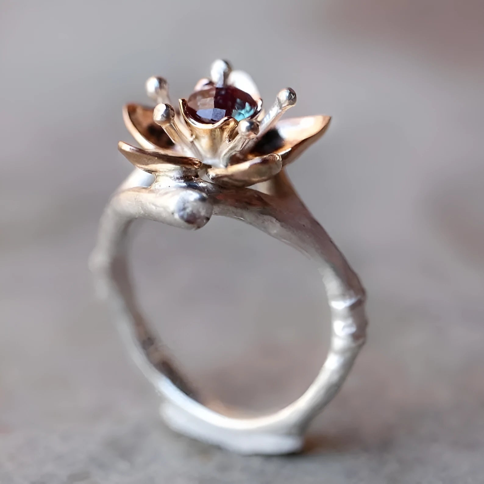 Silver two-tone floral pattern women's alloy fashion ring on a geometric band.