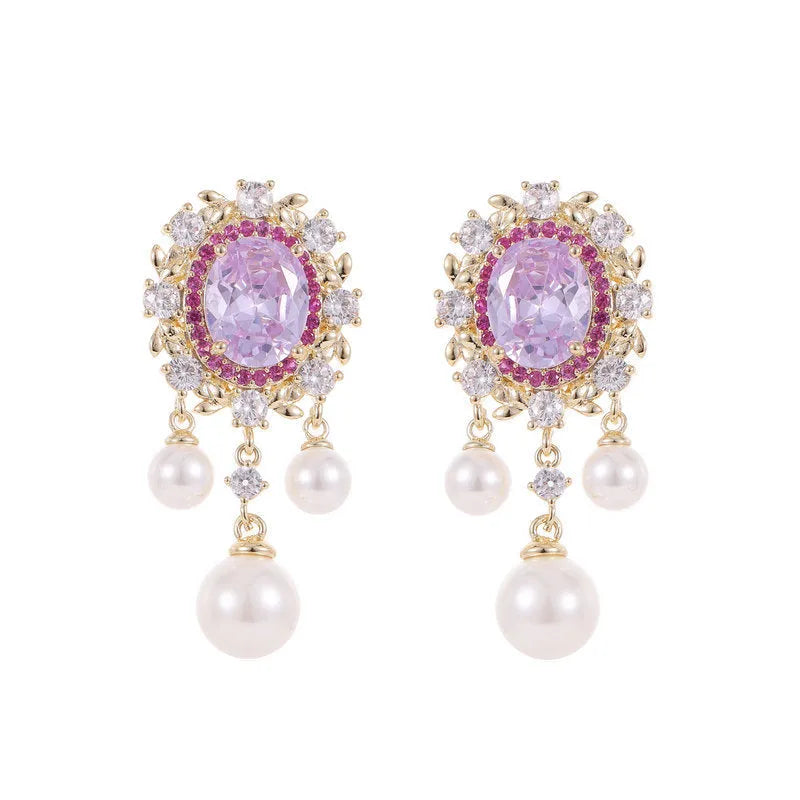 Oval-shaped copper earrings with inlaid zircon and a dangling pearl tassel in light purple.