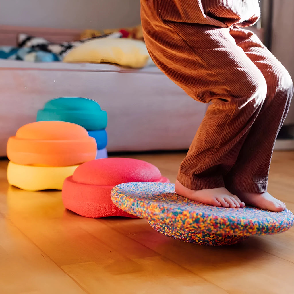 Plastic wood surf balance board for children, shown in mixed colour and black wood grain finishes.