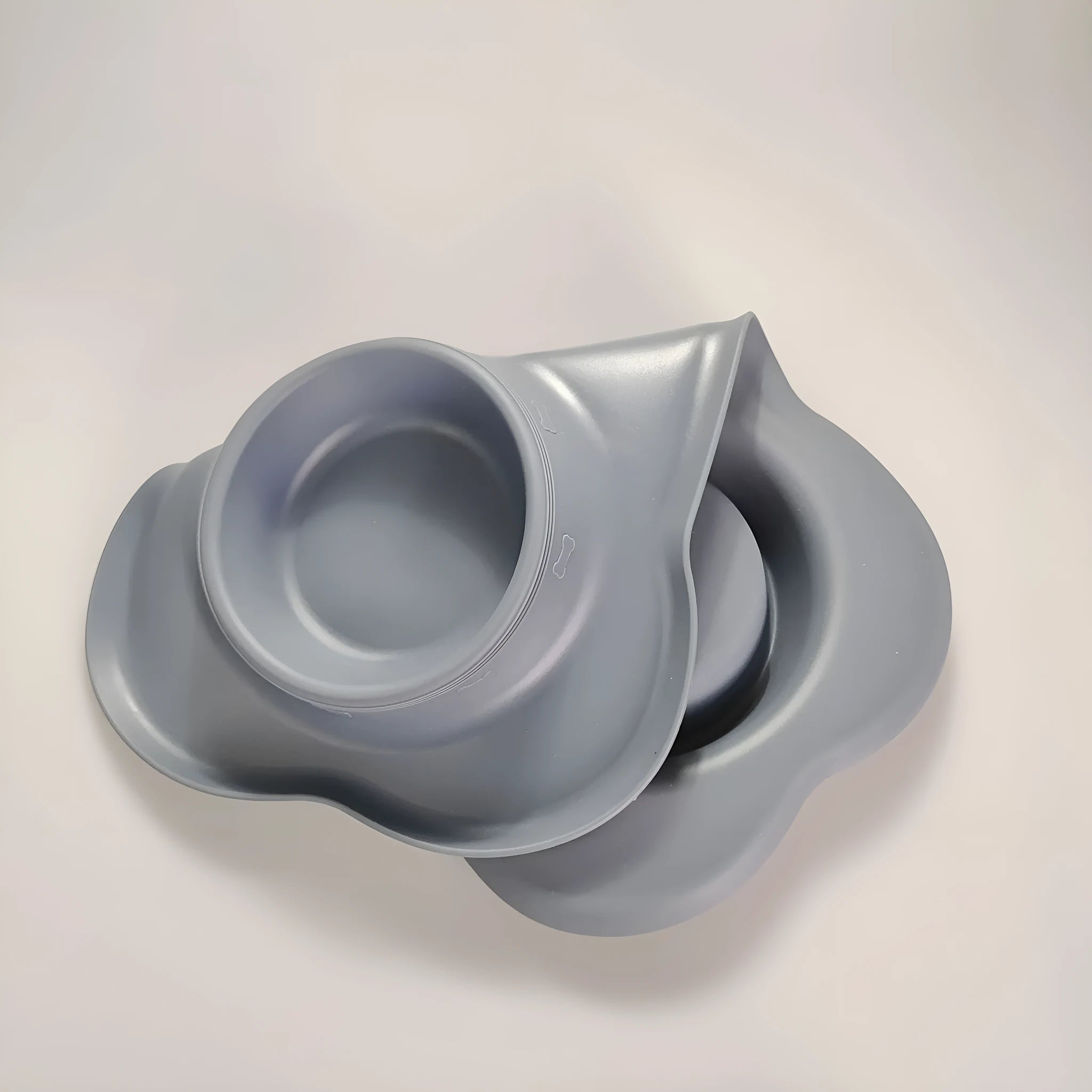 Large silicone double dog bowl with stainless steel inserts in raised feeding design