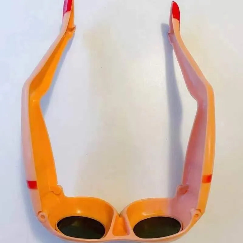 Orange plastic novelty sunglasses with leg hip design and oversize frame dimensions