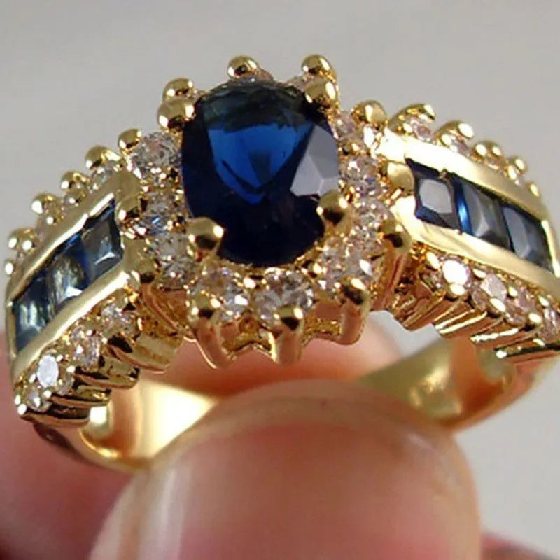 Personalised sunflower blue diamond ring and square-cut zircon designs in zinc alloy for unisex wear.