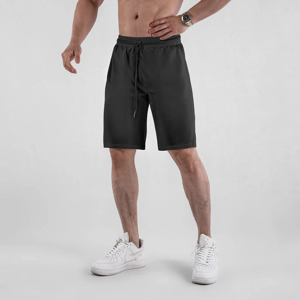 Men's white quick-drying mesh shorts with elastic waist and capri length for summer sports