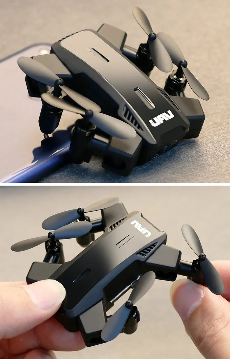 Quadcopter drone with HD 2 million pixel camera, black colour, propellers, and VR glasses on a white background