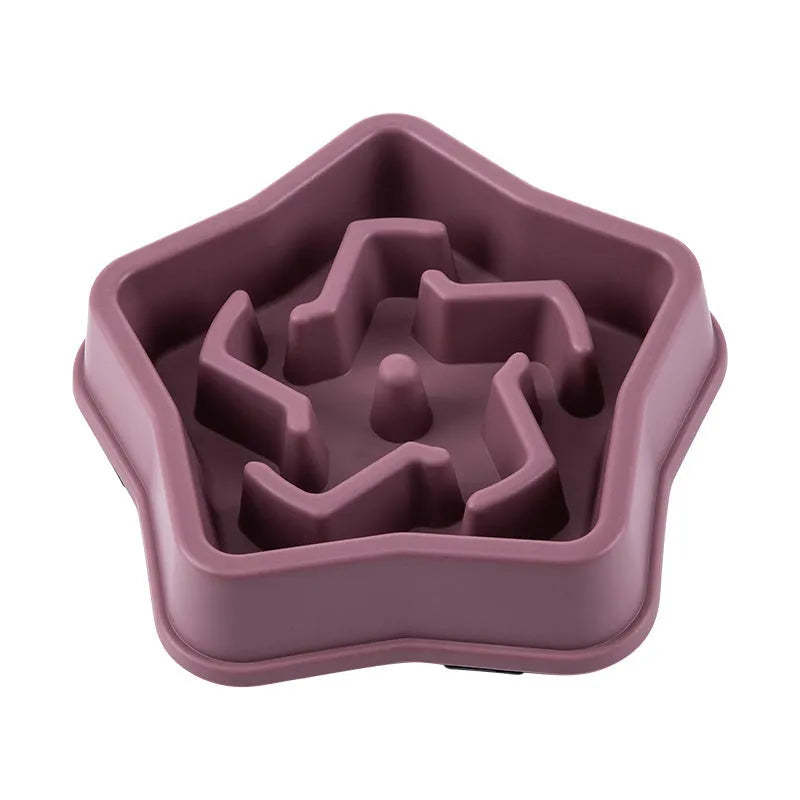 Yellow plastic dog slow feeder bowl with textured bottom and interior feeding obstacles