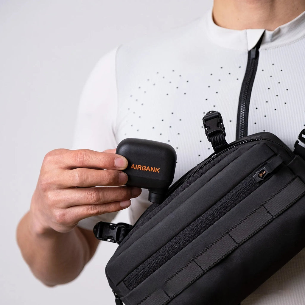 Black mini electric bicycle pump with USB cable and waterproof bag