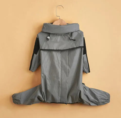 Dog wearing a reflective waterproof polyester raincoat in size M to 5XL for outdoor rain protection