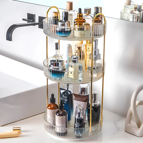Three-layer rotating bathroom cosmetics storage rack in green, yellow, and white on a desktop