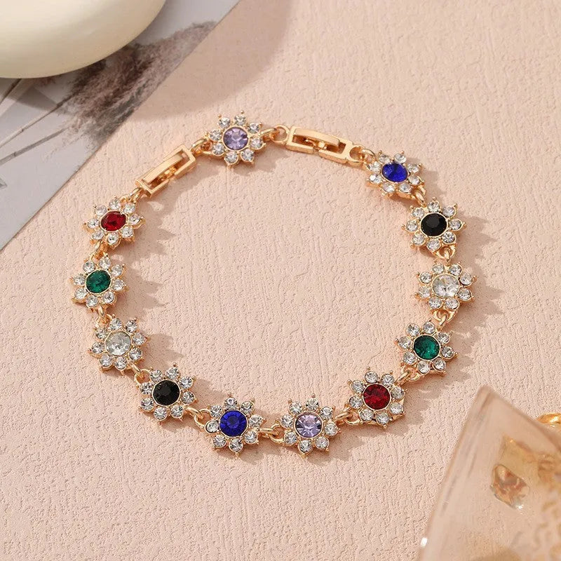 Flower design fashion bracelet in zinc alloy showing electroplated colour options with crystal and simulated diamond elements