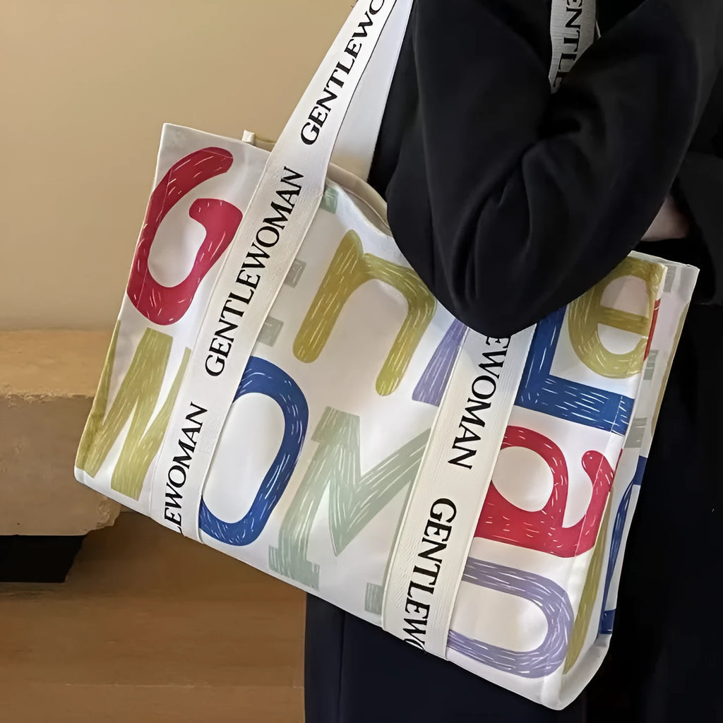 A large canvas tote bag with a printed design, shown in a choice of styles.