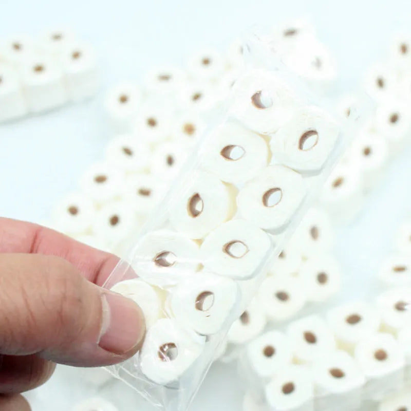 Paper simulated tissue roll model measuring 30mm wide 15mm deep 80mm tall