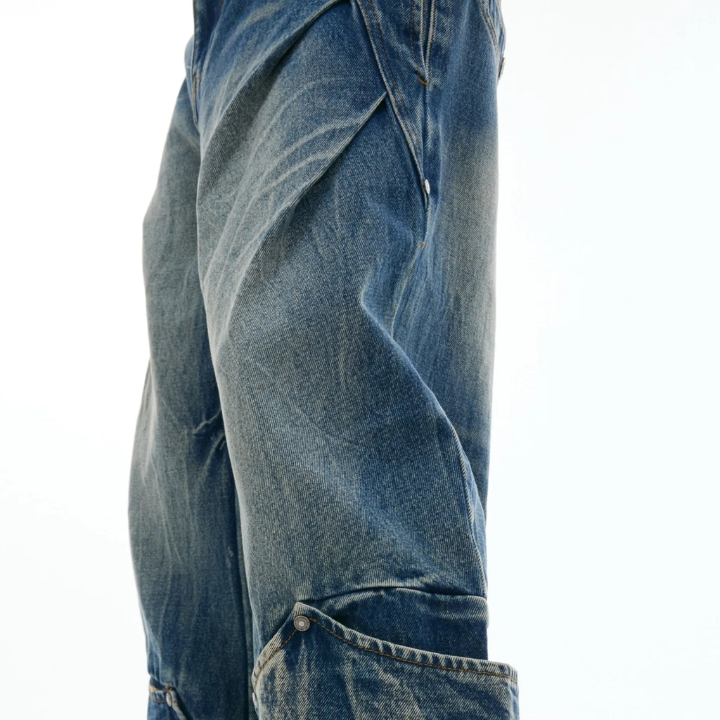 Men's verdant blue retro jeans with washed burst pattern and curved knife cut in loose fit