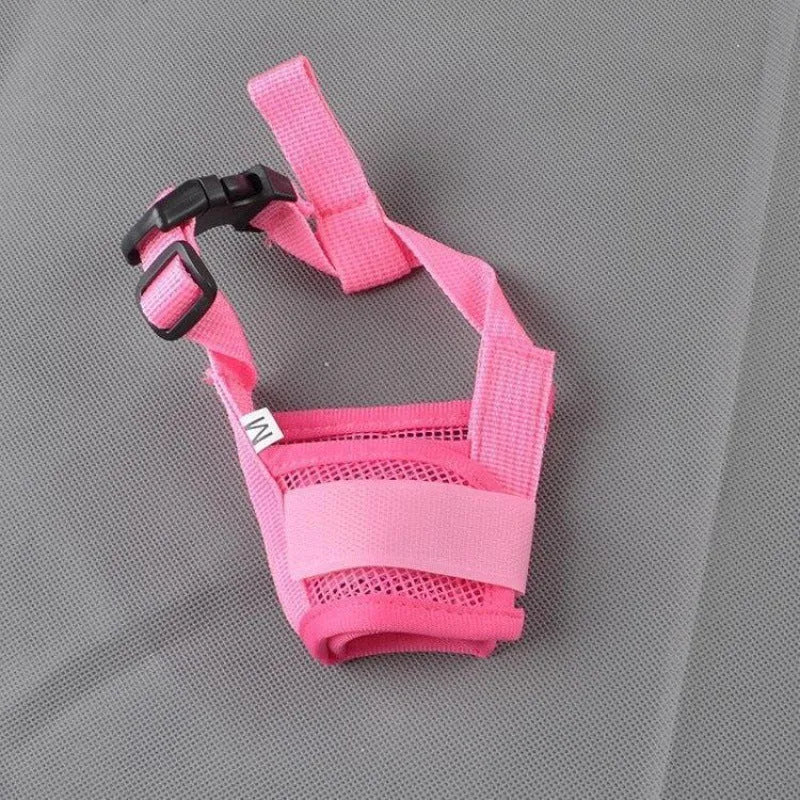 A plastic adjustable dog muzzle shown in multiple colours including black, blue, and pink.
