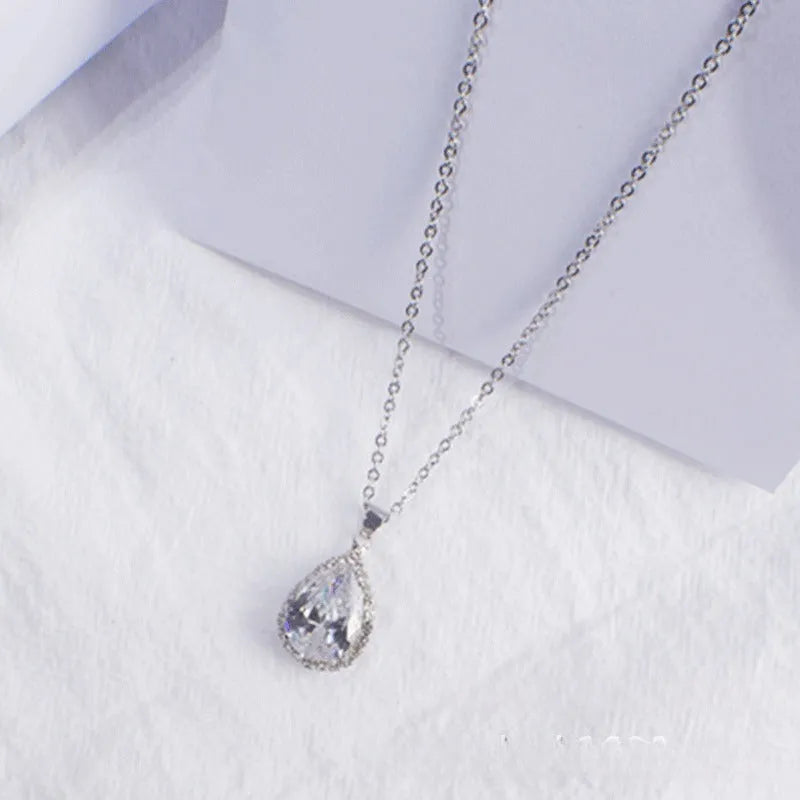 Women's pink rhinestone drop necklace with rose gold electroplated finish and geometric design