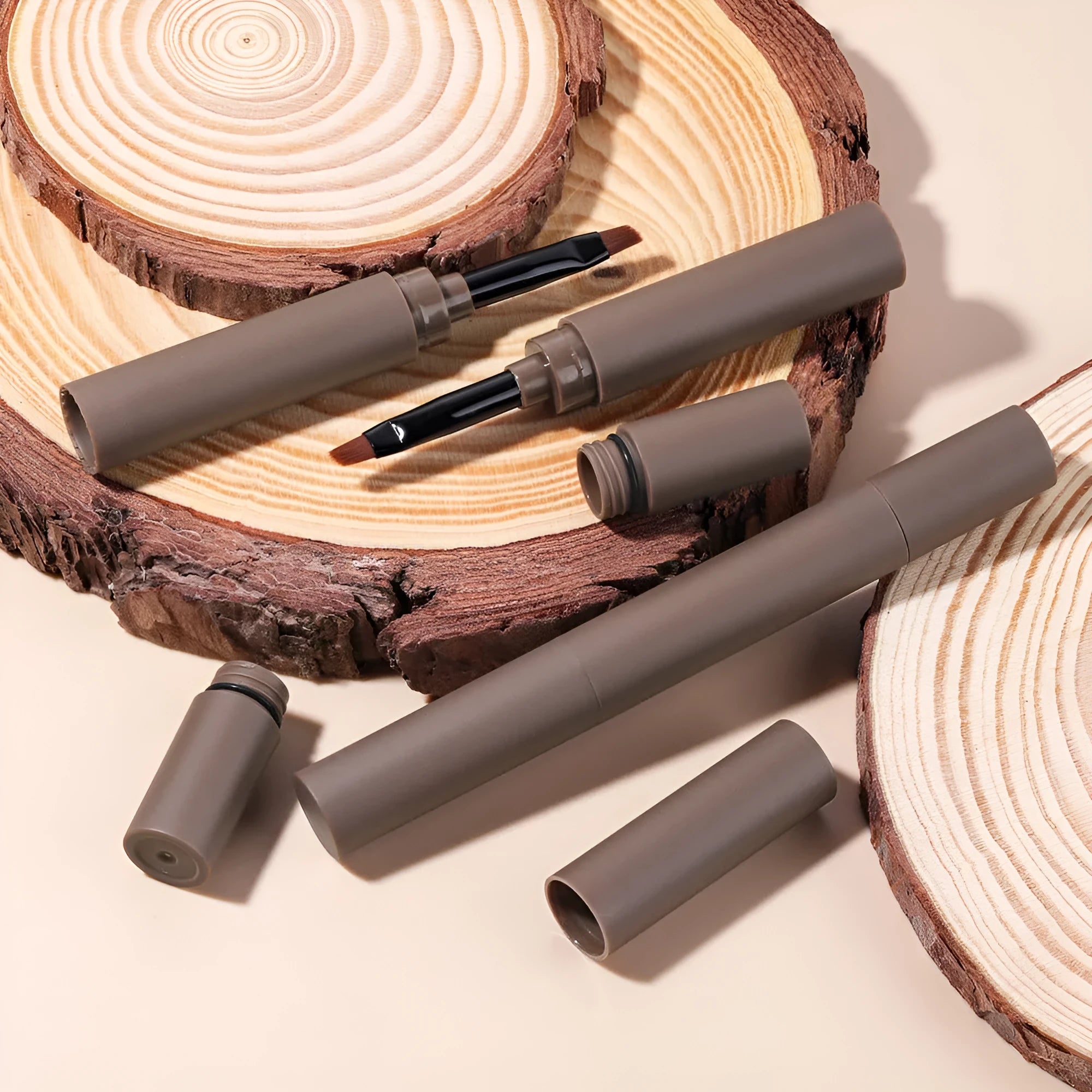 A double-headed eyebrow cream showing pencil and powder ends, with packaging indicating five colour shades.