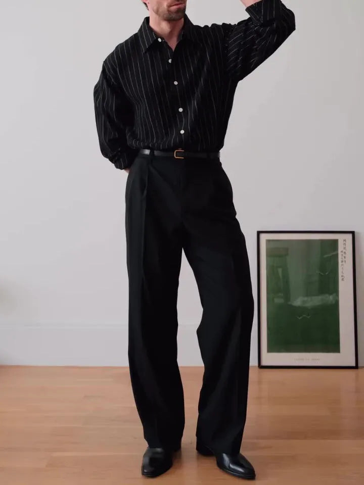 Black pinstriped polyester button-down shirt with regular fit on hanger
