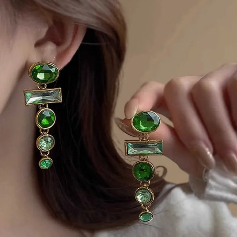 A pair of green gradient tassel earrings with geometric alloy settings and inlaid zircon stones.