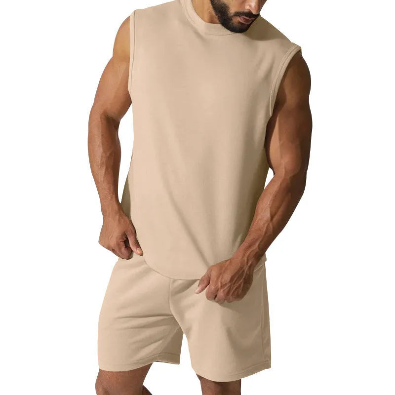 Men's sleeveless cotton blend sports top and matching shorts in a solid colour on a hanger.