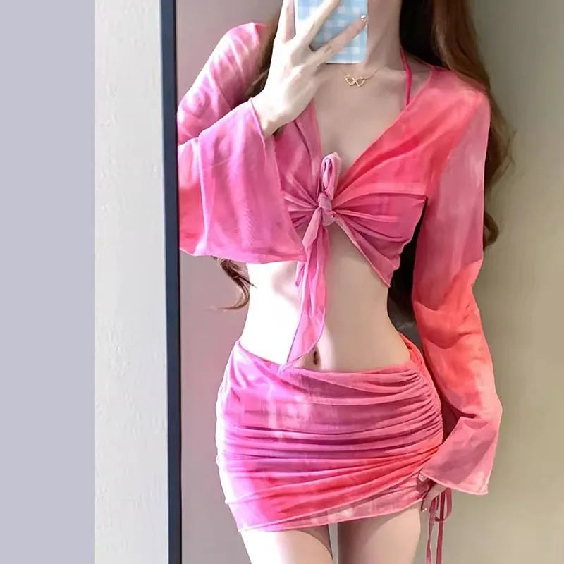 Blue high-waisted women's bikini four-piece set showing shirt, bra, underwear, and skirt.