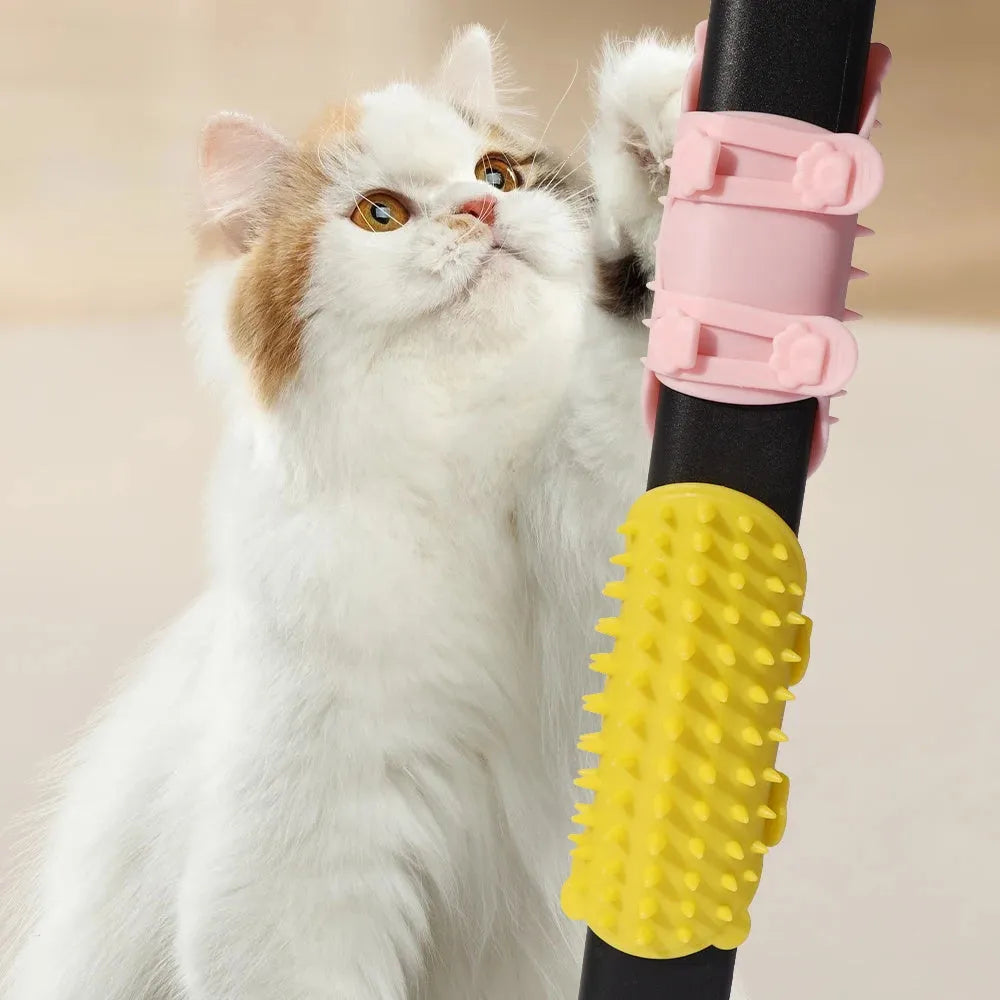 Silicone cat grooming and scratching brush with adjustable strap wrapped around a table leg.