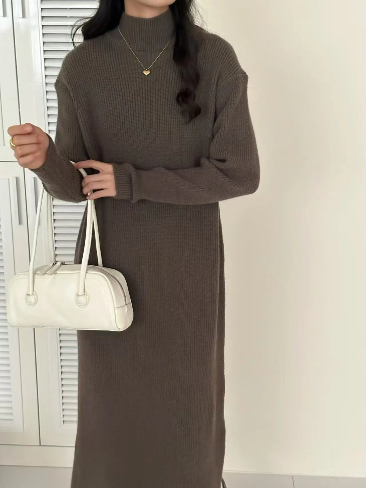 Acrylic knit high waist mid-length dress in solid colour with long sleeves.