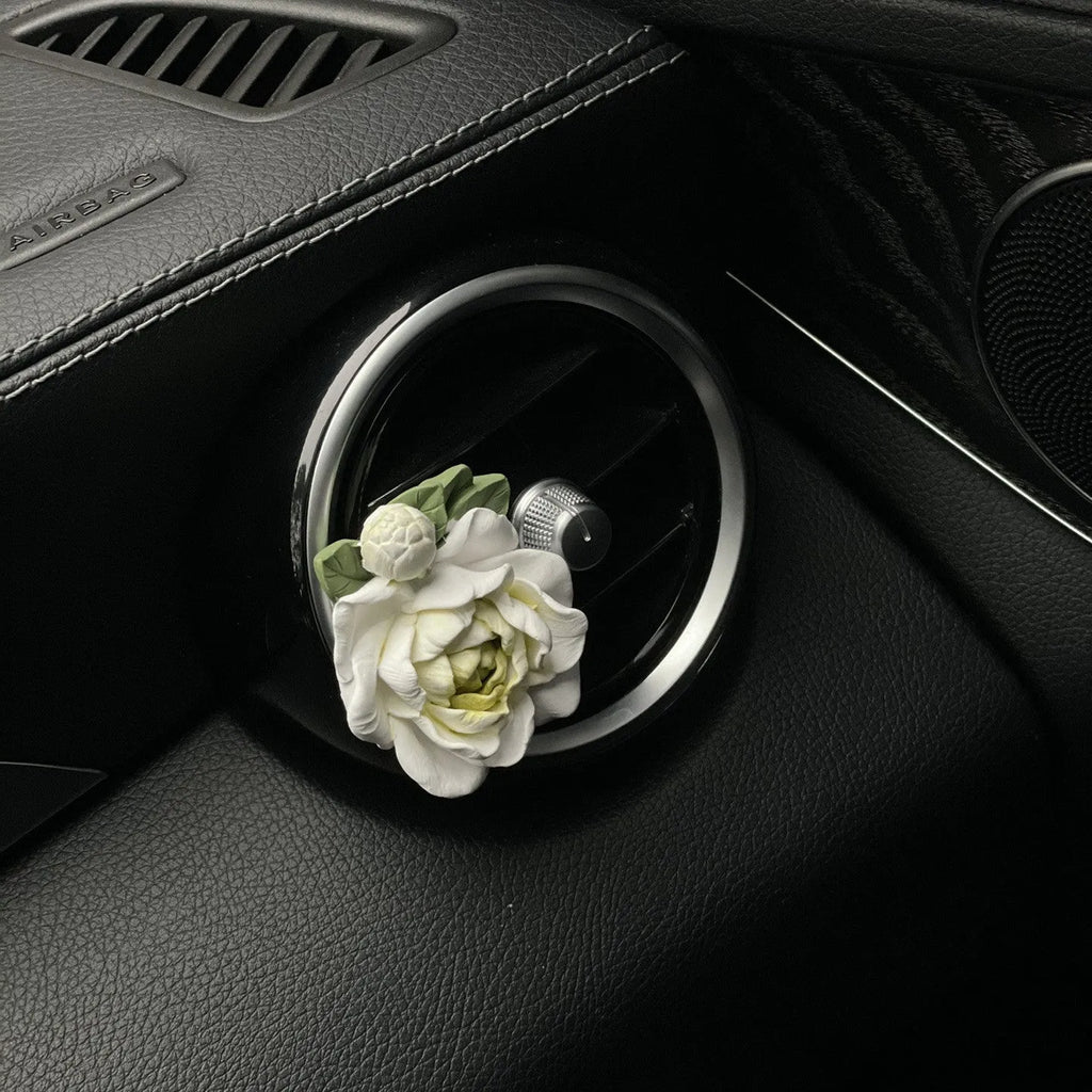 Solid gypsum car vent air freshener in jasmine fragrance, showing off-white or green colour.