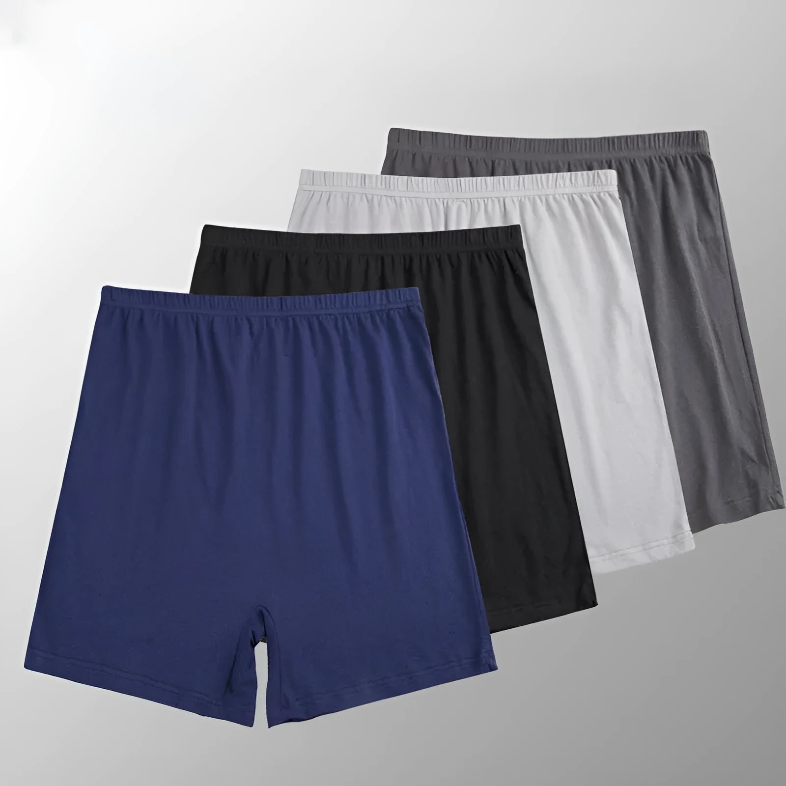 Men's solid colour modal boxers on a white background, showing high-waist design in black, blue, and gray.