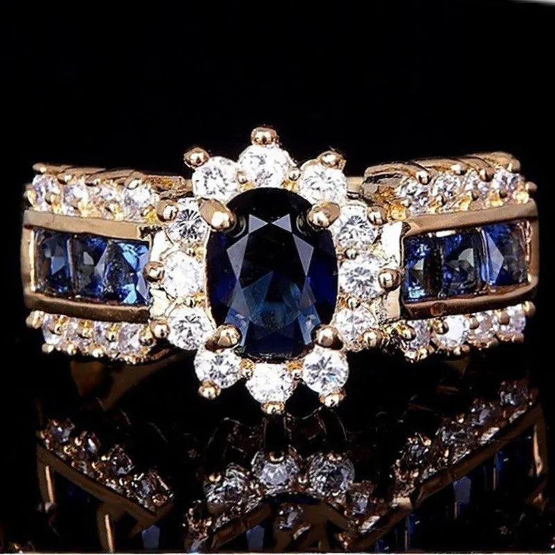 Personalised sunflower blue diamond ring and square-cut zircon designs in zinc alloy for unisex wear.