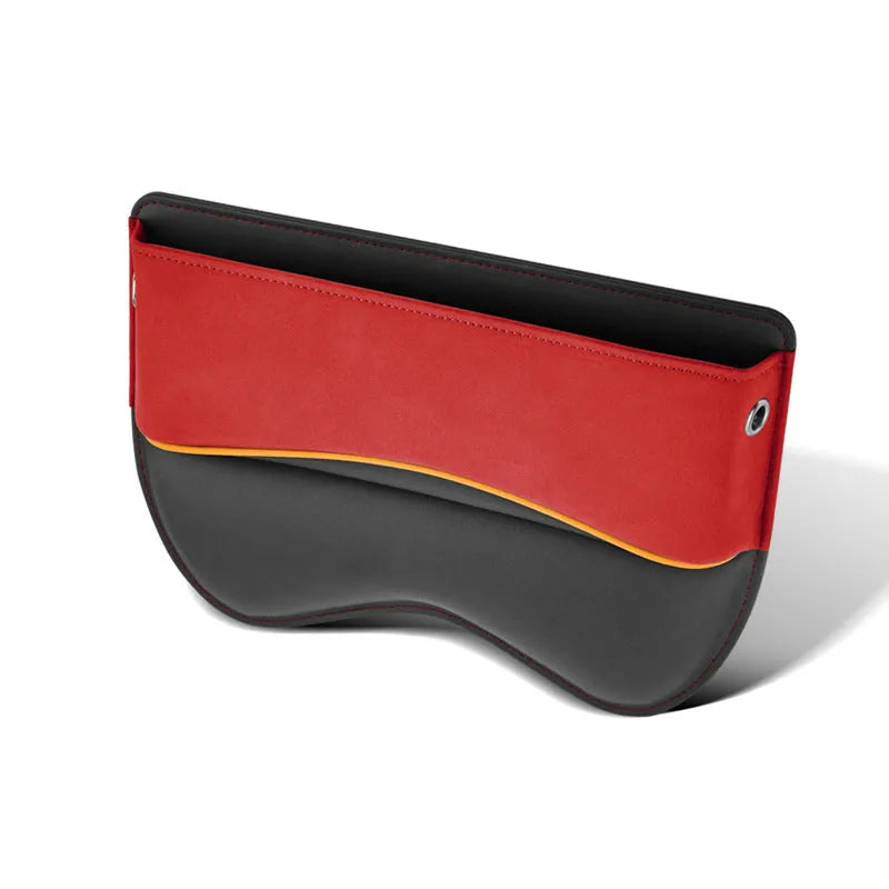 Black leather car seat storage box on a vehicle seat showing its rectangular shape and size.